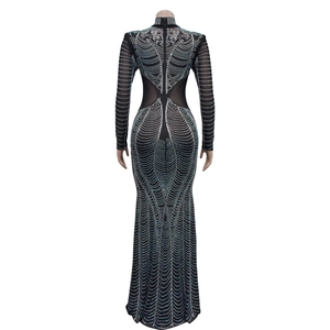 Detailed back view of a black fishtail dress featuring silver rhinestones and cut-out design