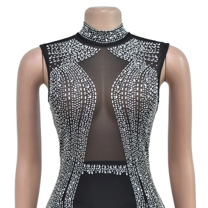 Detail of black mesh panel and silver rhinestones on sleeveless high neck top