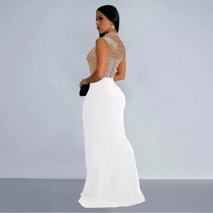 Detail of white evening dress featuring mesh patchwork and sparkling rhinestone embellishments