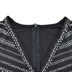 Close-up of deep V-neck with silver rhinestones and high-quality invisible zipper detail