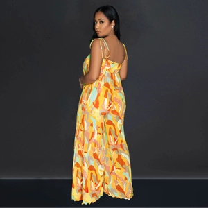 Detail of thin straps and open back design on a wide-leg jumpsuit with abstract prints
