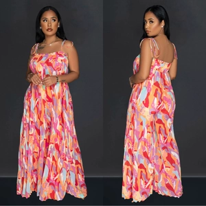Detail of wide-leg jumpsuit with colorful abstract print and pleated bodice design