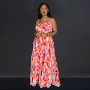 Detail of colorful abstract print and pleated texture on the wide-leg maxi jumpsuit