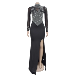 Detail of high neck black mesh dress with elegant pearl and beadwork embellishments