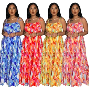 Detail view of four pleated wide-leg jumpsuits featuring abstract prints and camisole straps