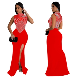 Detail of red sleeveless maxi dress featuring intricate rhinestone heart patterns