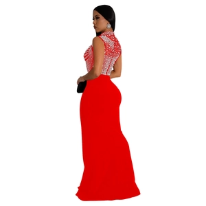 Detail of red floor-length evening dress with white mesh pearls and stand collar