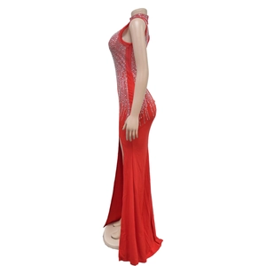 Detail of red sleeveless maxi dress with silver rhinestones and high side slit