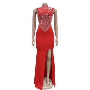 Detail of red sleeveless gown with mesh bodice adorned with pearls and rhinestones