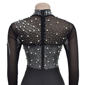 Detailed view of black mesh bodysuit with pearls and silver rhinestones on the back