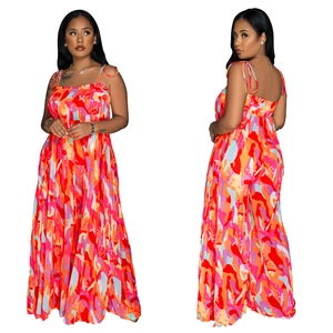 Detail of colorful abstract print wide leg jumpsuit with pleated texture and spaghetti straps