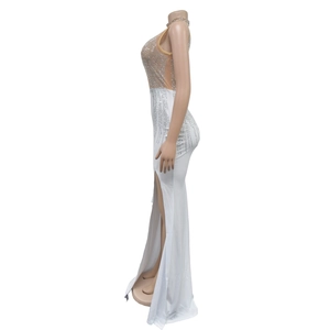 Side view of elegant sleeveless dress with sparkling silver rhinestones and high slit