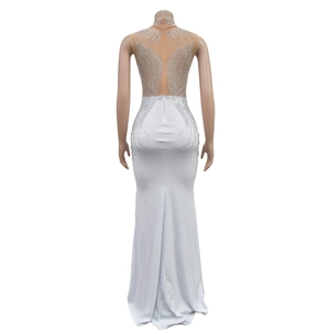 Detail of white fisheye dress with symmetric silver rhinestones and mesh back panel