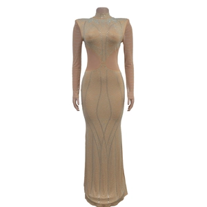 Detail of sheer mesh mermaid dress with silver rhinestones and padded shoulders
