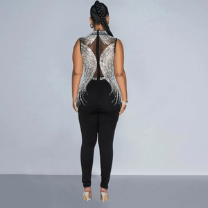 Macro view of mesh back detail with silver rhinestones on black sleeveless jumpsuit