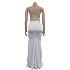Detailed back view of white evening dress featuring pearl mesh top and satin mermaid skirt