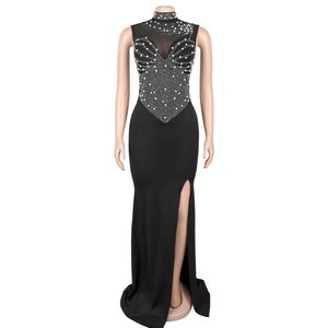 Detail of high neck black gown with intricate white pearls and rhinestones decoration