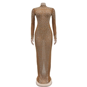 Detail of nude mesh maxi dress with sparkling silver rhinestones and high mock neck
