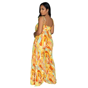 Detail view of colorful printed wide-leg jumpsuit with pleated waist and thin straps