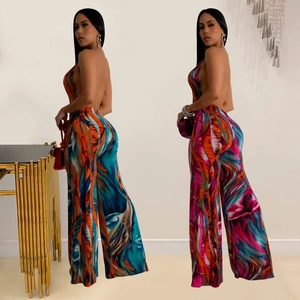 Detail of backless high waist jumpsuit with vibrant oil painting print and wide leg cut