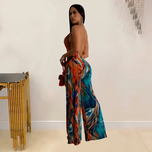 Detail of colorful backless jumpsuit with abstract oil painting print and wide leg cut