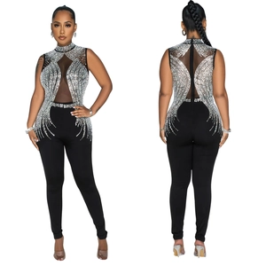 Detail of mesh bodice featuring sparkling rhinestone starburst pattern on sleeveless jumpsuit