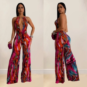 Deep V-neck sleeveless halter jumpsuit with colorful abstract print and wide legs