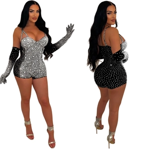 Detail view of black mesh bodysuit with silver rhinestones and matching long gloves