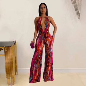 Close-up of deep V-neck halter jumpsuit featuring vibrant abstract artistic prints