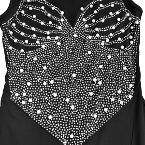 Detailed view of intricate pearl and rhinestone embroidery on a black slim-fit dress