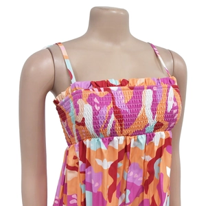 Detail of smocked chest design and vibrant abstract print on a summer jumpsuit