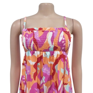 Close-up of smocked bodice detail on colorful abstract print summer jumpsuit