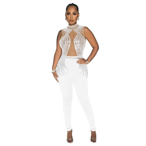 Macro view of white jumpsuit featuring intricate sequins and mesh details on the neckline