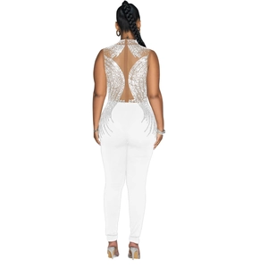 Detail of white jumpsuit featuring mesh back with silver rhinestones and feather patterns