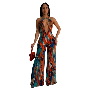 Detail of multi-color striped jumpsuit featuring a deep V-neck and halter neckline