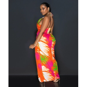 Detail view of the open-back halter neck and tropical floral print on a long maxi dress