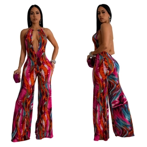 Detail of multi-color abstract print on deep V-neck backless wide-leg jumpsuit