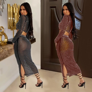 Detailed view of sheer mesh two-piece set with sparkling rhinestones and side slit