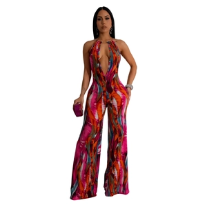 Detail of colorful abstract print on deep V-neck wide leg halter jumpsuit