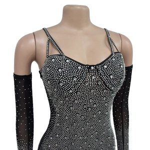 Detailed view of black mesh bodysuit with shiny silver rhinestones and matching long gloves