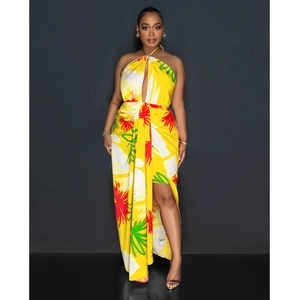 Detail of tropical floral print dress with halter neckline and high slit cut for summer