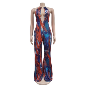 Close-up of abstract marble print jumpsuit with deep V-neck and halter neckline detail