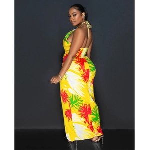 Detail of yellow backless halter maxi dress with tropical floral print and elastic waist