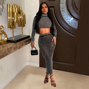 Elegant two-piece set featuring a rhinestone mesh crop top and high-waisted long skirt