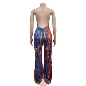 Detail of backless sleeveless jumpsuit with blue and orange marble print and flared legs
