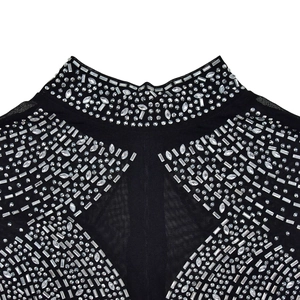 Detail of high collar black mesh jumpsuit with silver rhinestones in geometric patterns