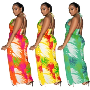 Tropical leaf print backless halter maxi dress in orange, yellow, and green colors