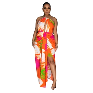 Detail of backless halter maxi dress with abstract floral print and side high slit