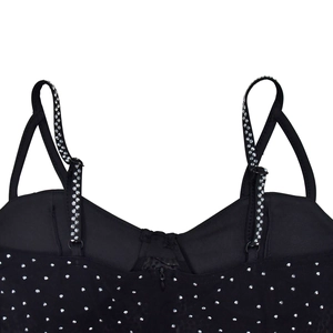 Detail of black mesh jumpsuit with rhinestone shoulder straps and hidden back zipper