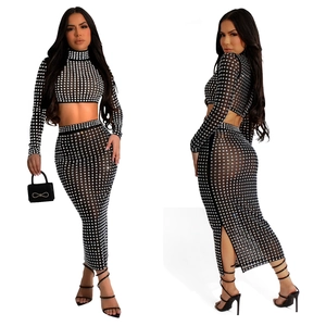 Detail view of women's two-piece mesh set with sparkling square pattern and side slit